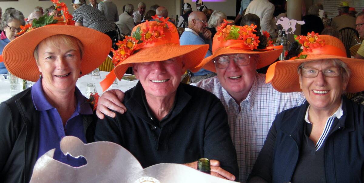 Fashion and fun: Robyn McGinnes, David Stanley, Norm Dodds and Helen Chadwick donned the hats for the 2015 Melbourne Cup at the Bowral Golf Club. Photo: supplied