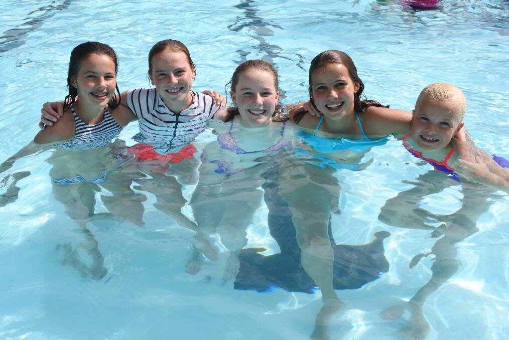 Keeping it cool: While it wasn't planned, Jessica, 13, Anneliese, 13, Georgie, 13, Mia, 12, and Georgia, 10, met up in the water at Plugged at the Pool. Photo: Claire Fenwicke
