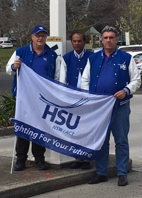 IN THE DARK: Health Union Services staff Peter Mason, Dr Mani Sentill and HSU state secretary Gerard Hayes outside Bowral and District Hospital. Photo: supplied