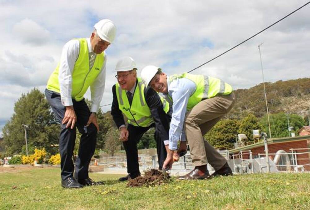 Regional boost: Federal Member for Hume Angus Taylor (right) turns the first sod of Goulburn Mulwaree’s upgraded Wastewater Treatment plant with council general manager Warwick Bennett (left) and Mayor Bob Kirk. Photo: supplied