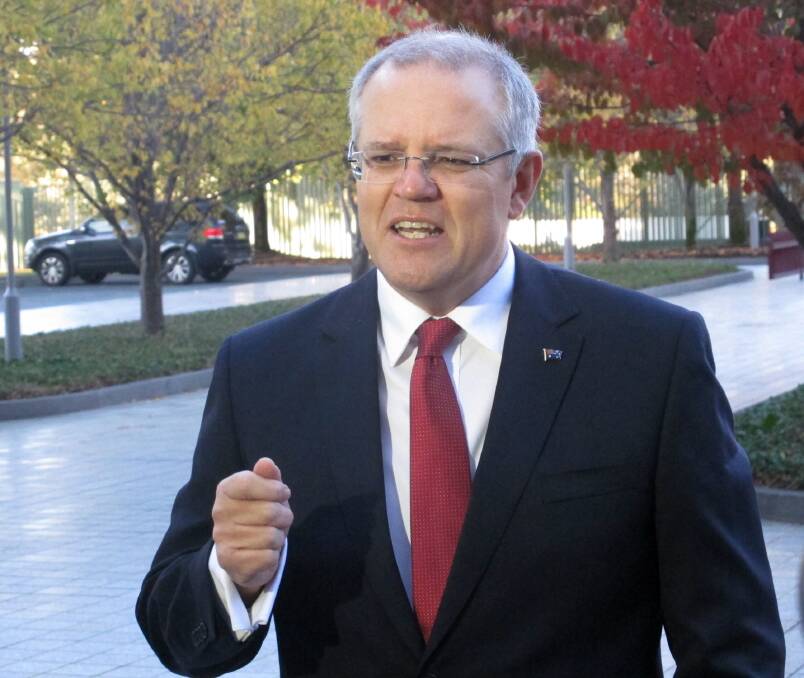Treasurer Scott Morrison talking to media at Parliament House in Canberra, May 9. Morrison says he will outline a budget for the next fiscal year that will be fair and rein in mounting debt. Photo:AP Photos/Rod McGuirk