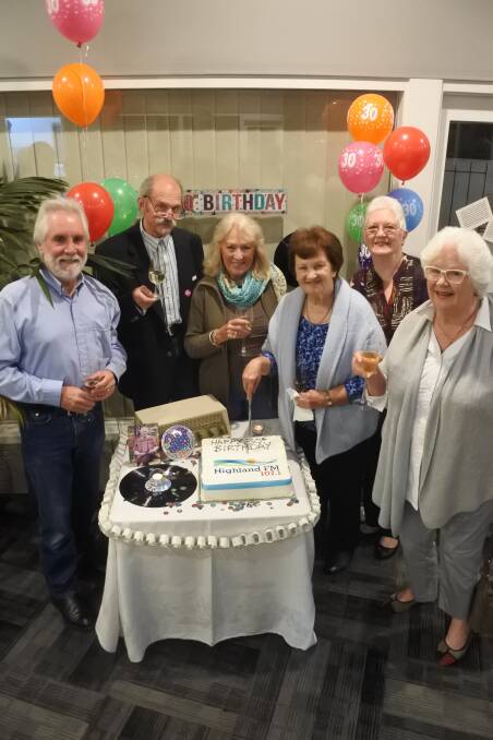 Let the good times continue: Highland FM 107.1 presenters Stuart Forlonge, John Sider, Heather Parkes, Robyn Elliott, Anne Robinson and Sally Andreas cutting the cake marking 30 years of community radio. Photo: Claire Fenwicke