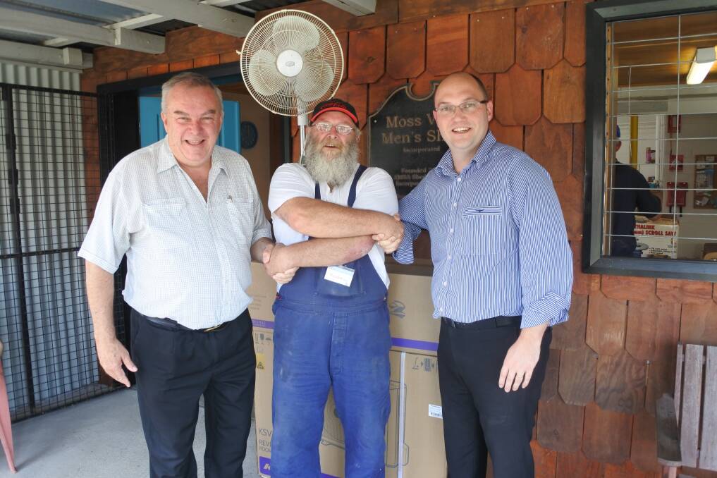 Moss Vale Men's Shed patron Ian Scandrett with president Richard Milne and Harvey Norman Moss Vale's Lee Sanger-Young. Photo: Claire Fenwicke