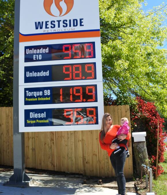 New fuel supplier: Westside Petroleum manager Sandra Sleiman, with her daughter Sylvana-Lisa, shows off the competitive prices at the new station. Photo: Claire Fenwicke