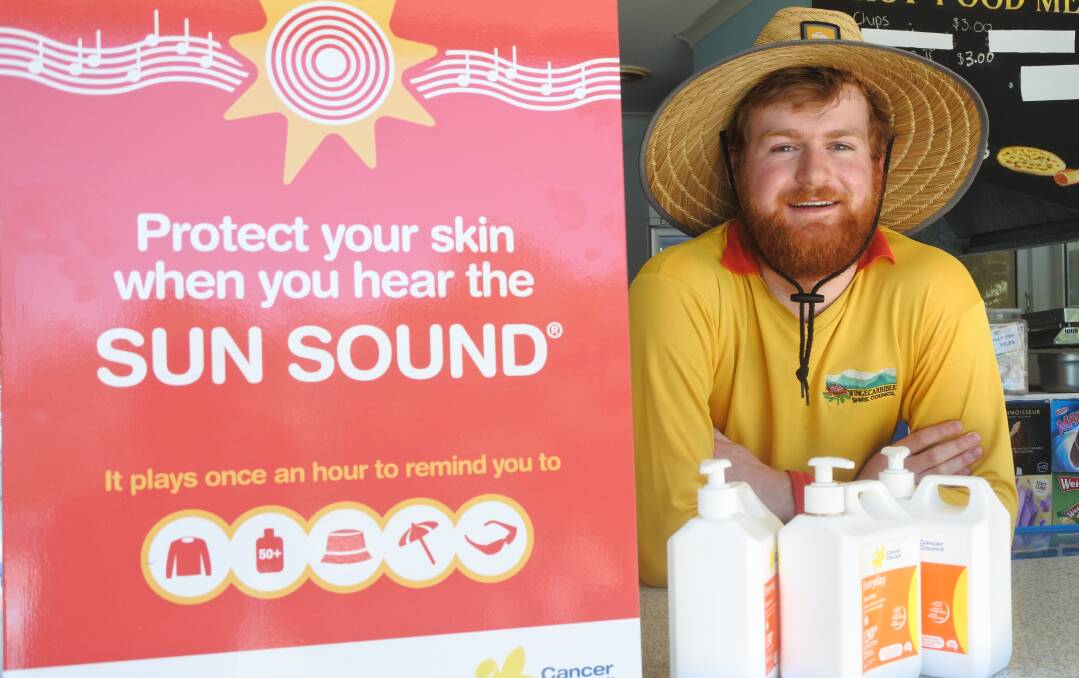 Keeping you protected: Bowral Swimming Centre lifeguard Matthew Dunn preparing for the next sun sound with plenty of free sunscreen for swimmers. Photo: Claire Fenwicke