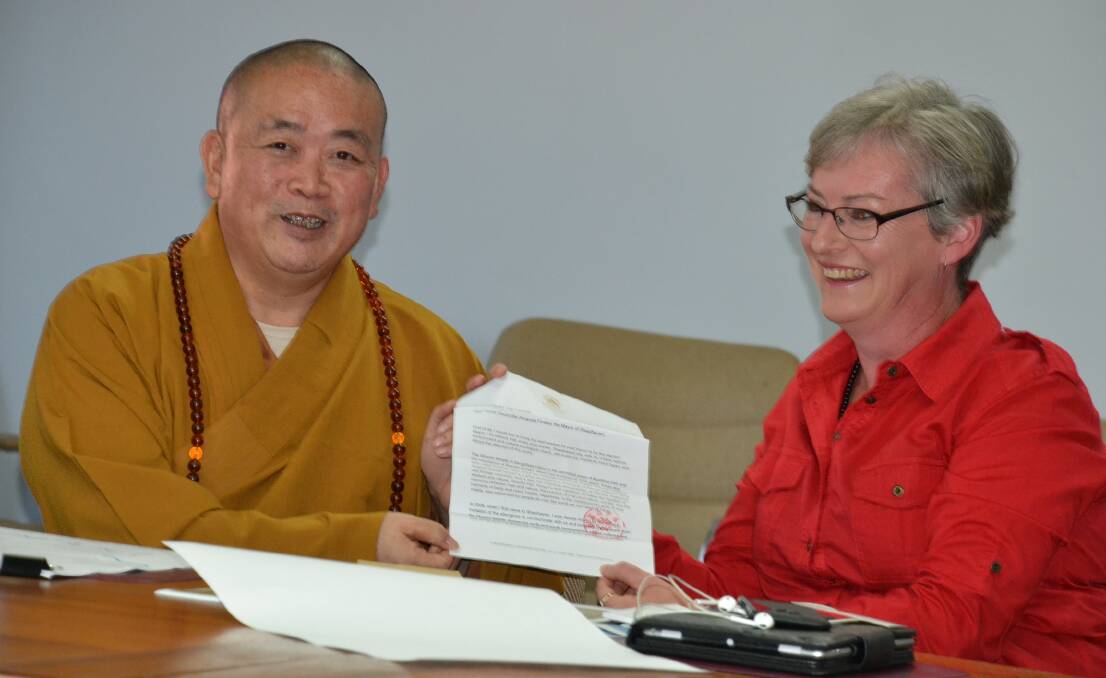 Shaolin Abbot, Shi Yongxin formally invites Shoalhaven Mayor, Amanda Findley to visit China.