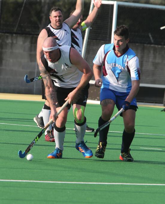 Sticks Croker in action for Berry Black in his side's 4-1 win over Shoalhaven Heads in Saturday's Shoalhaven Hockey grand final. Photo: Robert Crawford