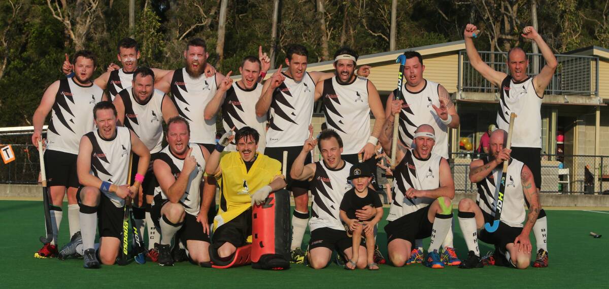 Sticks (second right front row) celebrates his side's Shoalhaven Hockey grand final win. Photo: Robert Crawford