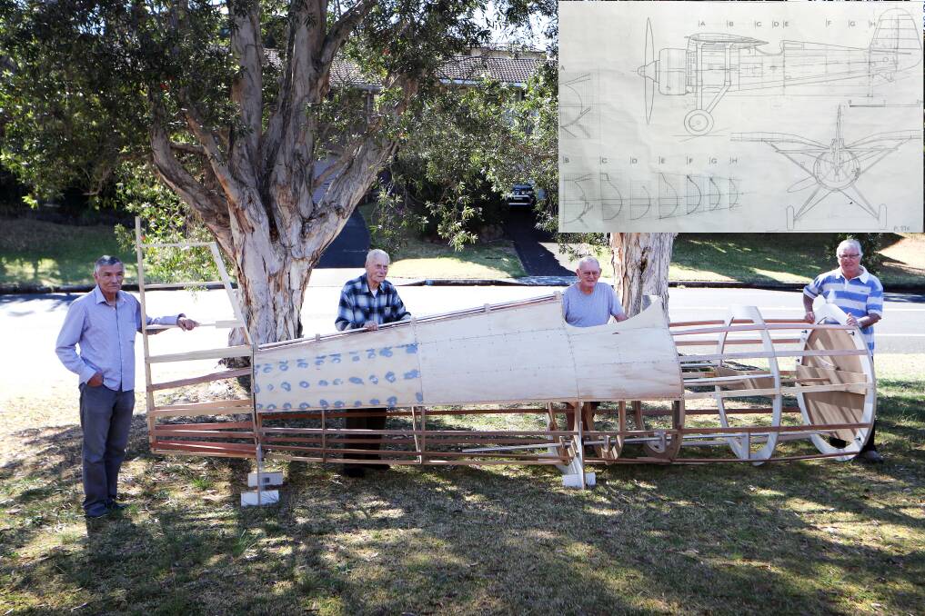 THE BEGINNING: Andrew Krajewski, Tony Suryak, Peter Daly and Ben Patynowski are making a life-size static replica of a PZL P11c fighter plane, used by Polish forces in World War II (above with plans). Picture: Sylvia Liber