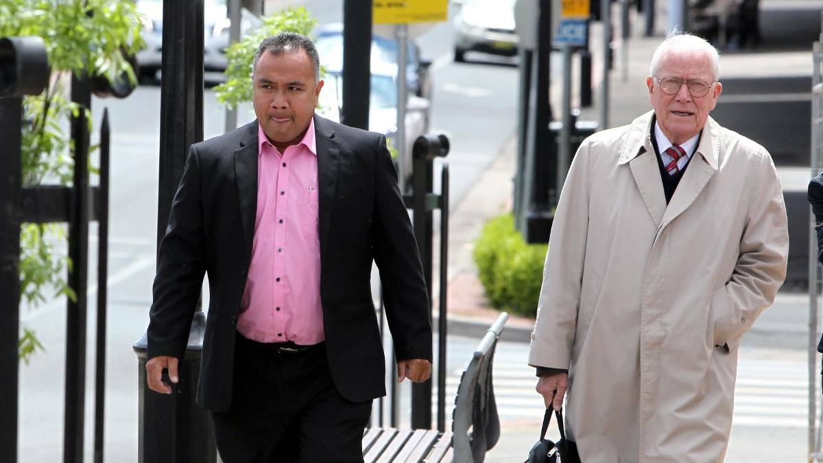 Father Neru Leuea about to enter court with his solicitor, Simon MacKenzie. Picture: Les Smith