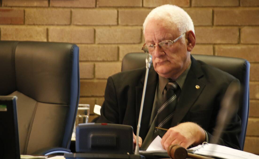 Mayoral Election: Ken Halstead takes a seat at the head of the table after he was elected mayor of Wingecarribee Shire Council for a two-year term. Photo: Victoria Lee