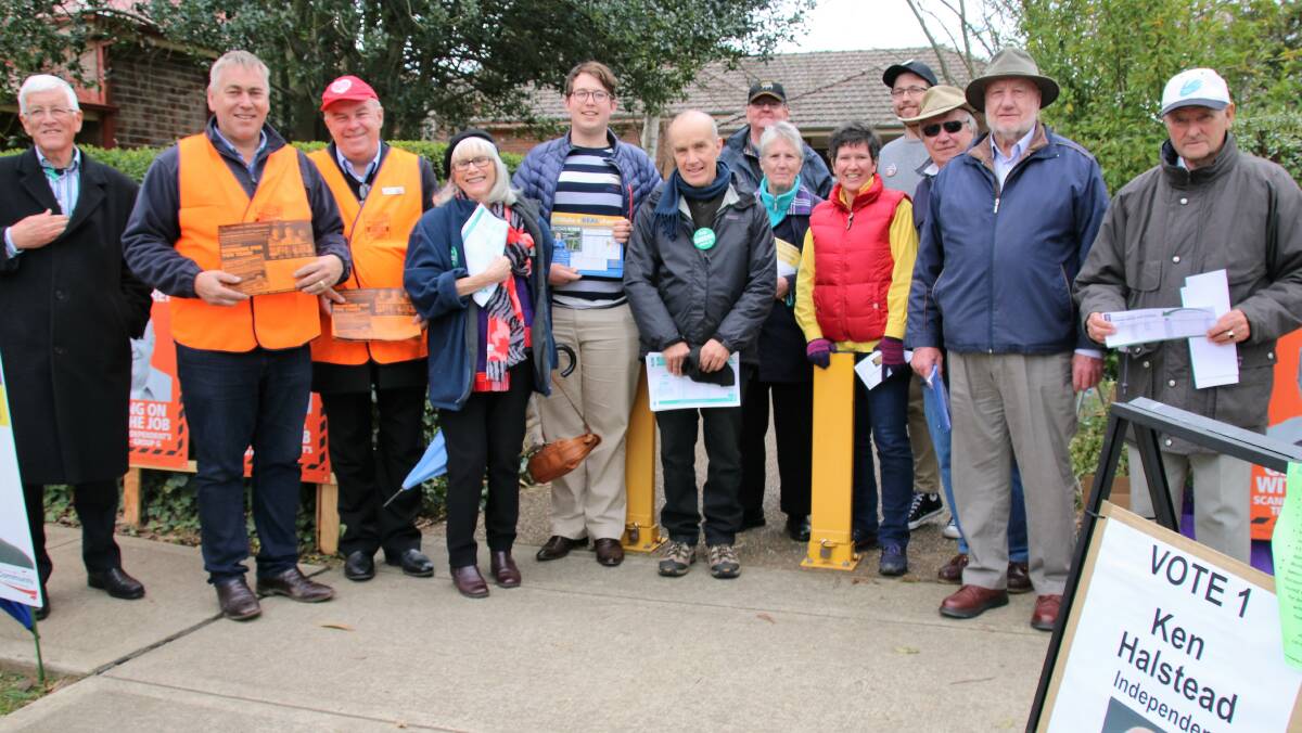 VOTE 1: More candidates and volunteers vie for votes at St Thomas Aquinas Church Hall in Bowral on election day. Photo: Victoria Lee