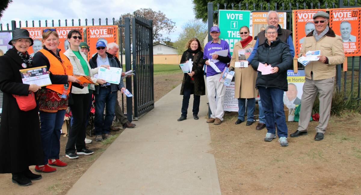 VOTE 1: Candidates and their volunteers greet voters at Mittagong Public School on election day. Photo: Victoria Lee