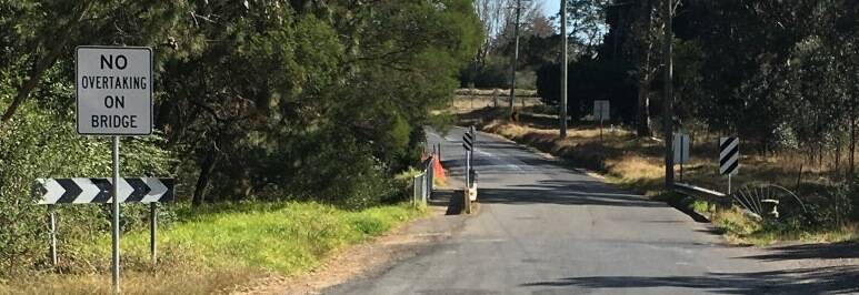 Work still underway: Council roadworks at Colo Street bridge over Nattai Creek have been further delayed by days of rain, forecast from February 27 onward. Photo: WSC