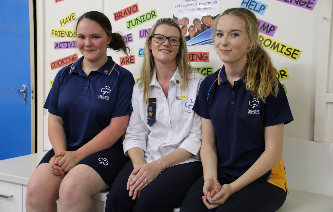 Taking off: Taylor O'Brien and Amelia Brook, with leader Lauren Brook (centre), said Girl Guides created opportunities they wouldn't have otherwise had. Photo: Victoria Lee