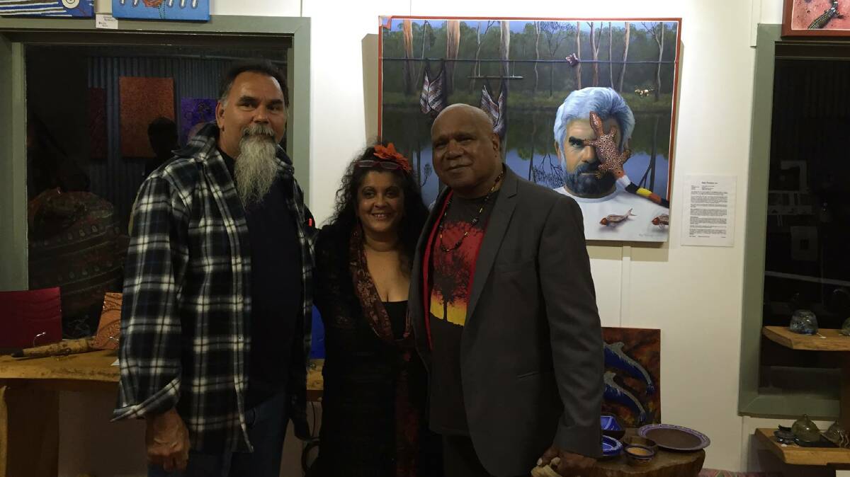 Merryn Apma, centre, spoke at the Sorry Day event and is pictured in her gallery back in March when she hosted a concert with artist Ray Thomas and Archie Roach. 