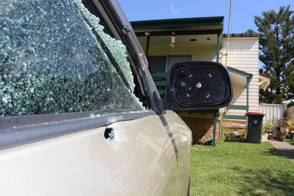 Bullets smashed the windows and pierced the body of a car parked on the home's front lawn. Picture: Angela Thompson