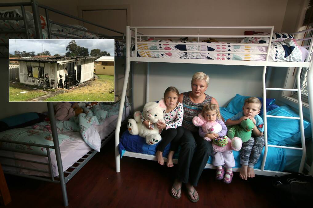 Justine Upton shares a room in Thirroul with Kirra, Blaze and Ned. Work has kept the children's father, Peter, in Western Australia for most of the eight months since fire destroyed a neighbour's shed (inset). Main picture: Sylvia Liber