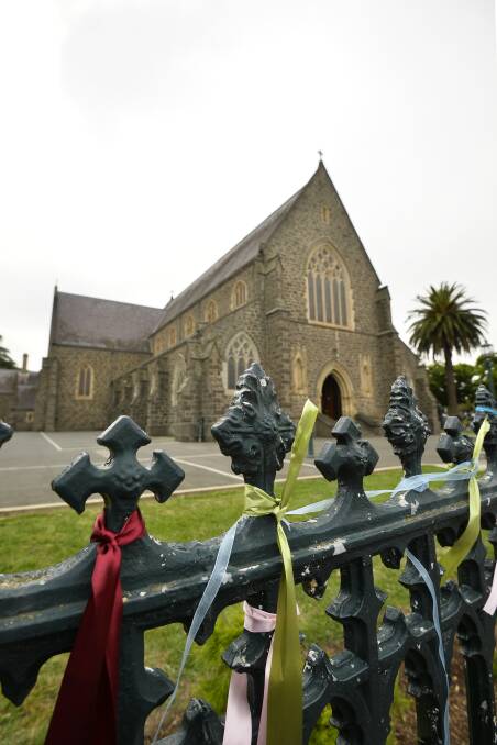 Fresh ribbons were attached to the St Patrick's Cathedral fence on Sunday. 