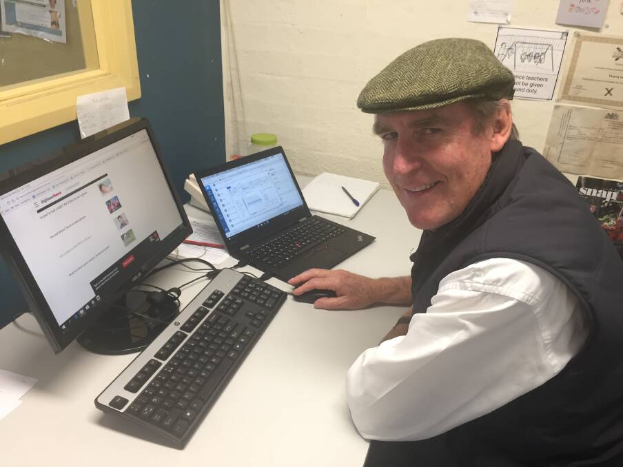 FIRST TRY: Columnist Geoff Goodfellow, who makes us smile with Across the River on Wednesdays, dropped into the newsroom to check out the new submission forms.