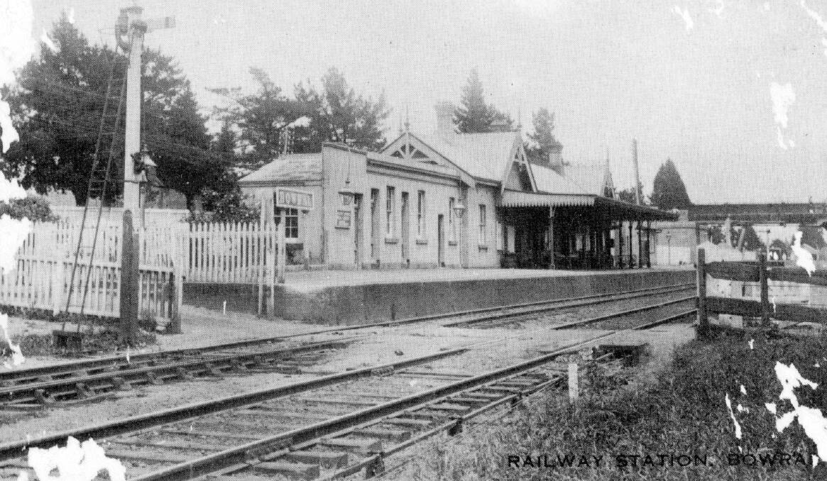 BETTER TO CROSS: Old level crossing at Bowral Station in foreground and new overhead bridge at south end, c1912.