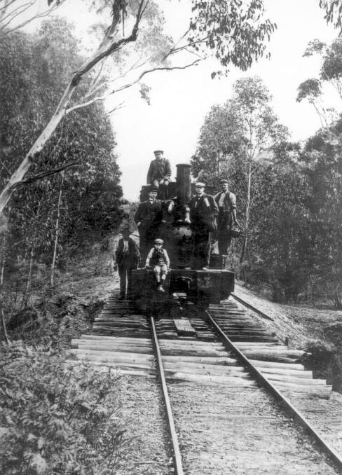ROUGH RIDE: A Joadja engine on a bridge of sawn logs across a dip in the terrain. Passengers were allowed to ride into town on the coal tender. Photo: BDH&FHS.
