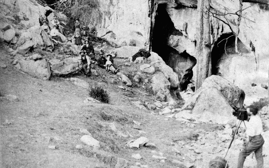 MEMORABLE: Visitors pose for the camera in 1898 outside the main chamber entrance at Wombeyan Caves. Photo: BDH&FHS.