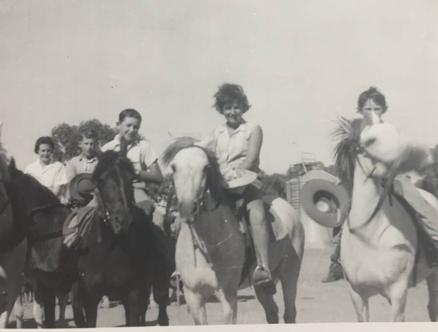 FARM KIDS: Edna (far left) with her siblings Joe, Robert, Sheila and Tom at Daisy Plains in Booligal, where hard labour was part of every day life.