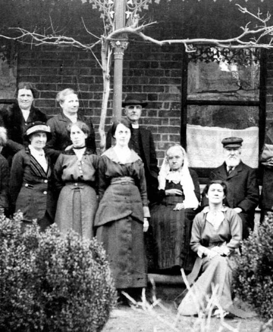 COMMUNITY SPIRIT: An elderly George and Dinah Osborn (at right) with some members of Bundanoon Holy Trinity Ladies’ Auxiliary, c1910. Photos: BDH&FHS
