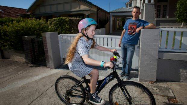 Callum Gordon with his daughter Macy Gordon-Heywood, who rides to school every day. Photo: Fiona Morris
