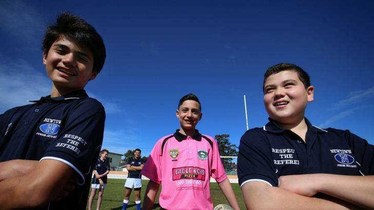 Newtown Junior players Kaylib Savage and Michael Sassine don "Respect our Refs" shirts to support junior referees such as Luke Prokopiou. Photo: James Alcock