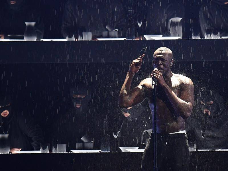 Stormzy delivered a powerful anti-UK government rap during the Brit awards in London.