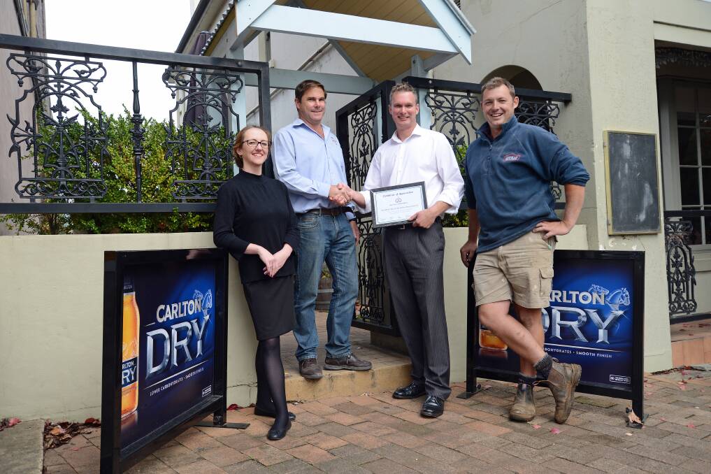 Hayley Rennie, David Kent and Troy Brown from Moss Vale Cricket Club present Tom Porter from Moss Vale Hotel/Porterhouse Bistro with a certificate of thanks.  
	Photos by Roy Truscott