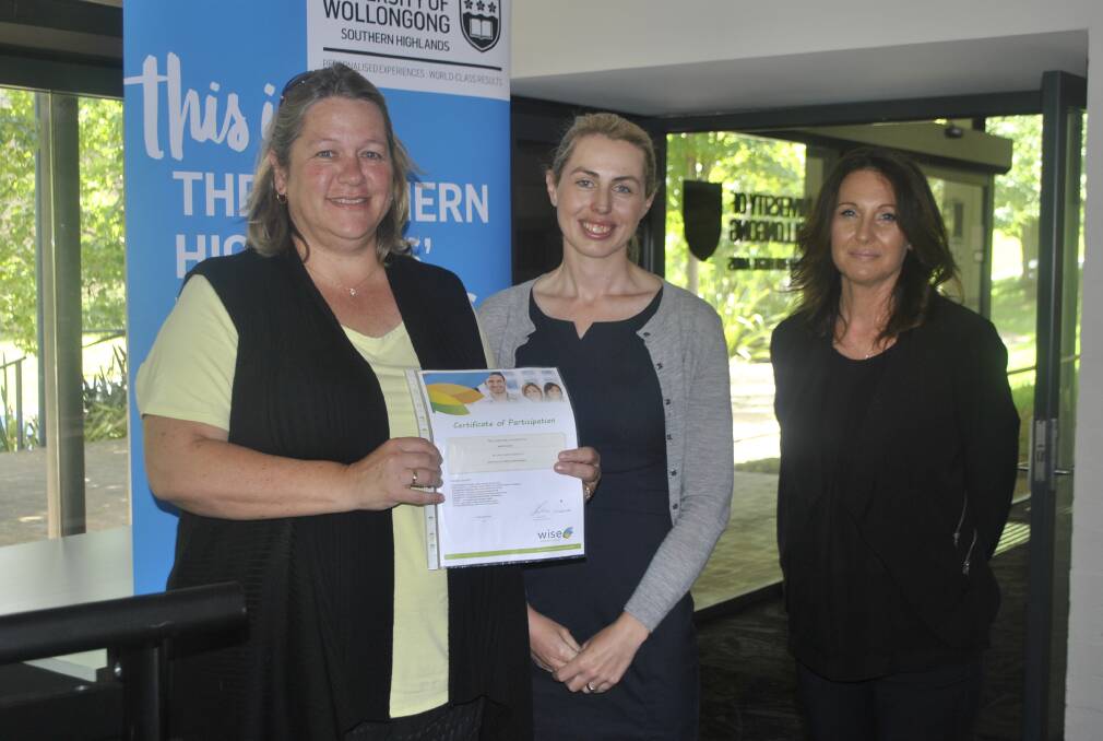 Maree Bates was presented with a certificate four in retail management by Keirin McCormack and Wise Education national manager Kylie Wakeham.