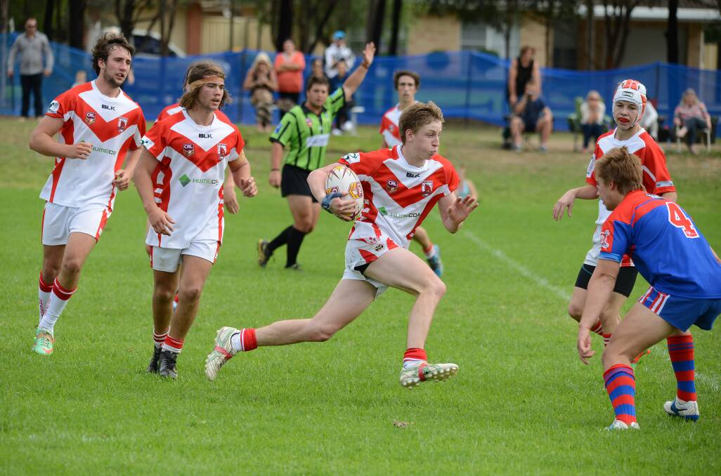 Moss Vale's Jake Newbury runs at the Mt Annan defence. Photos by Roy Truscott