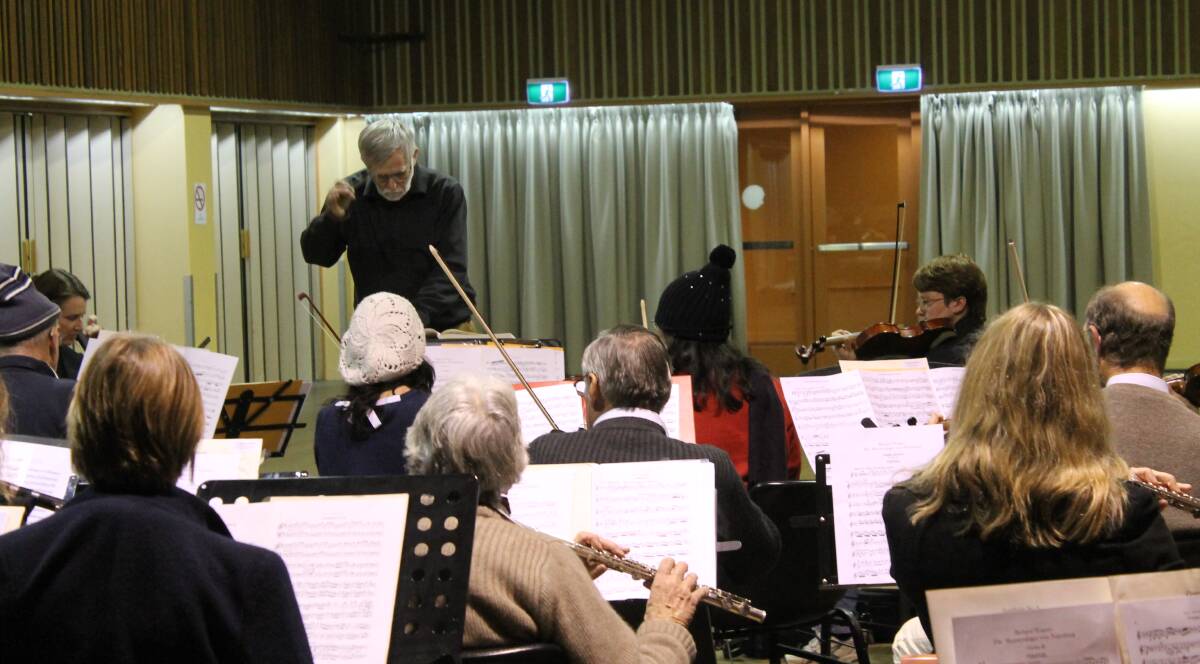 The Southern Highlands Symphony Orchestra practises, under the guidance of conductor Allan Stiles. 