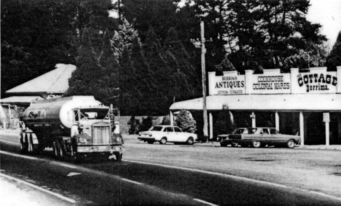 RISKY BUSINESS: A petrol tanker passes through the centre of Berrima on the highway, 1980s.	Photos: BDH&FHS