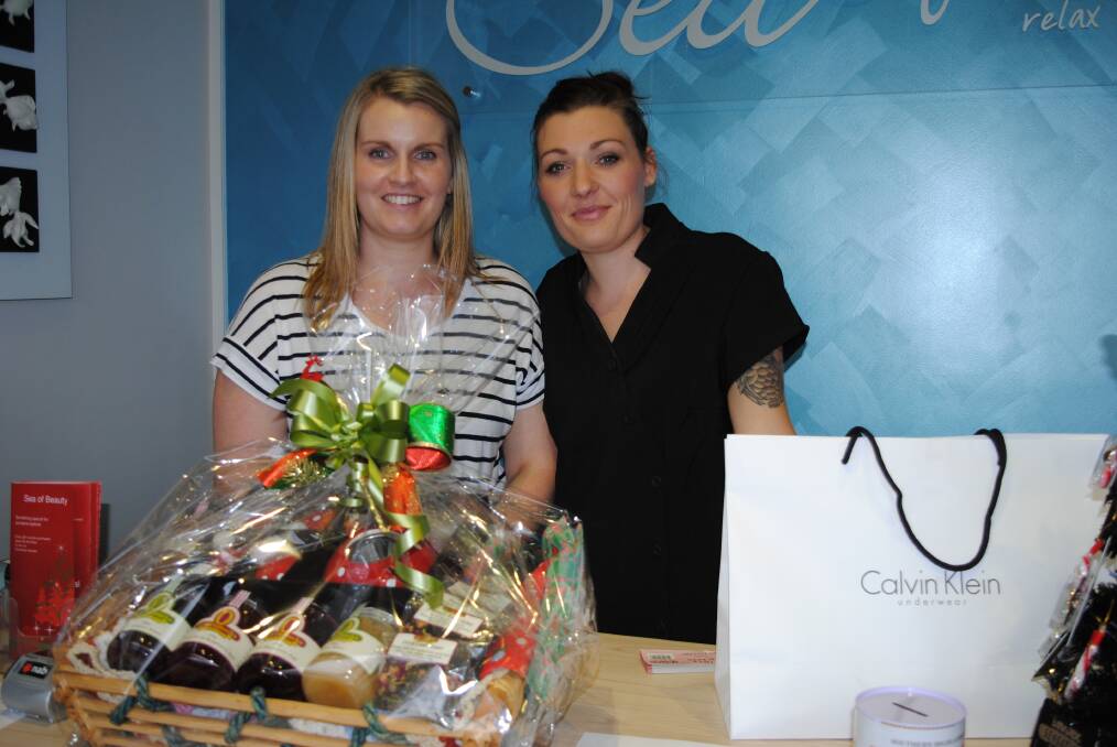 Kate Ford and Katie Hadju with the hamper raffle prize. Photos by Emma Biscoe