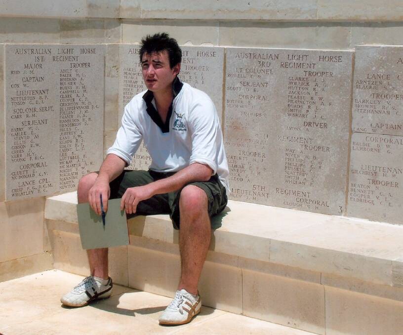REFLECTIVE: Sam Goodfellow sitting with his mate Corporal Fred Crisp, in the Australian section of war memorial at Gallipoli.  
	Photo courtesy Wollongong University