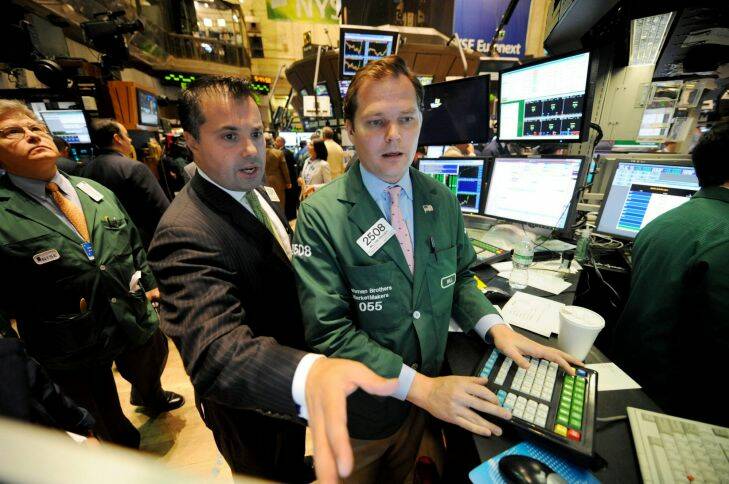 William Brazer, right, of Lehman Brothers MarketMakers, and Anthony Campagna of Speer, Leeds, Kellogg work on the floor of the New York Stock Exchange, Friday, Sept. 19, 2008, in New York. Wall Street extended a huge rally as investors stormed back into the market, relieved that the government plans to rescue banks from billions of dollars in bad debt. (AP Photo/Henny Ray Abrams)