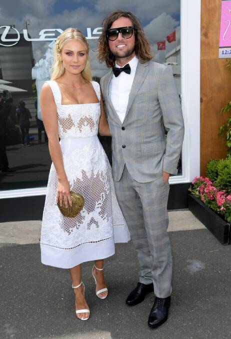 Josh Barker and Elyse Knowles (left) in the Lexus Marquee at the Birdcage on Victoria Derby Day at Flemington Racecourse in Melbourne, Saturday, November 4, 2017. (AAP Image/Tracey Nearmy)