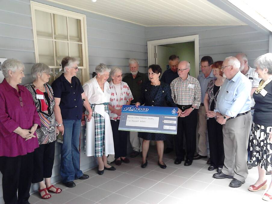 Local MP Pru Goward presents a cheque to members of the Berrima District Historical and Family History Society. Photo by Philip Morton
