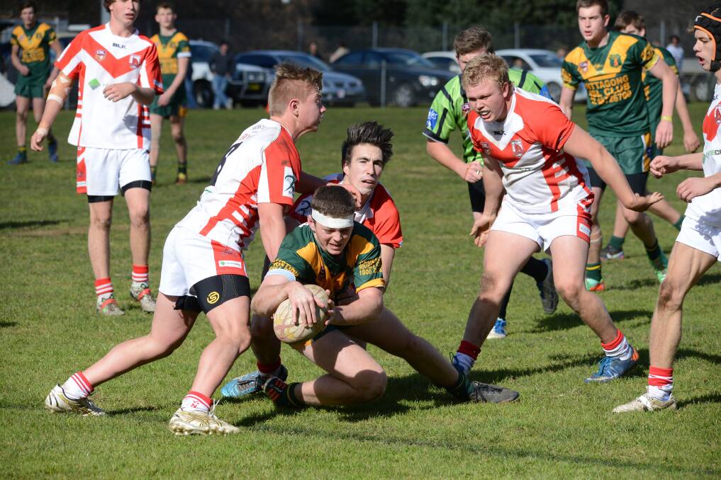 Lion's Jordan Powell crashes over to score Mittagong's third try of the game. 
	Photo by Roy Truscott