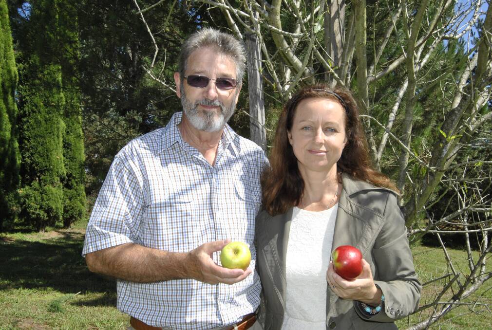 Barry and Julie Clark with apples picked straight from the tree.