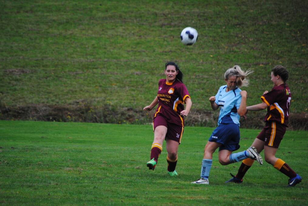 Robertson's Bri Handley clears the ball away from her back line during a recent football match. Photo by Josh Bartlett