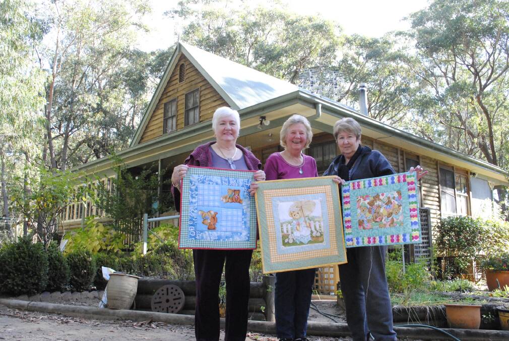 Barbara Mitchell, Carmen Lee and Anne Read at Simbra Cottage with their quilted 'blankets oflove' for the mothers of stillborn ladies. Photo by Megan Drapalski