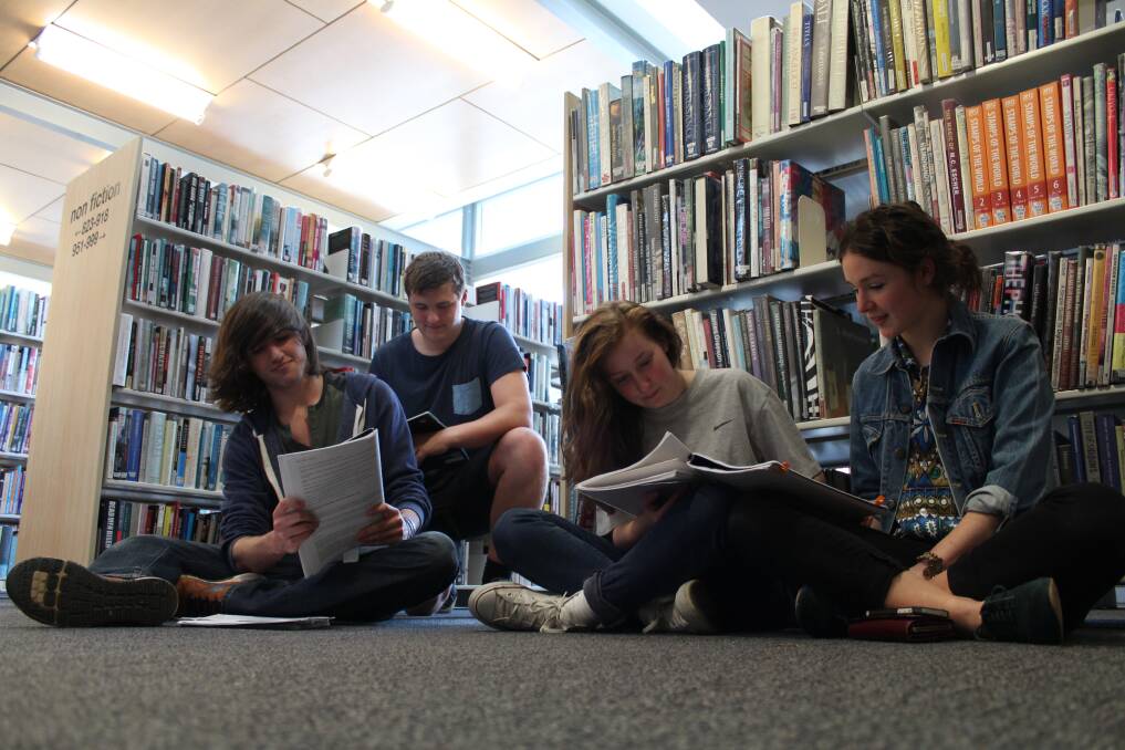 Bowral High School students Zach Bertram, Rory MacDonald, Ashleigh Millward and Lulu Talbot study for their HSC exams in the Bowral Central Library. 	Photo by Megan Drapalski