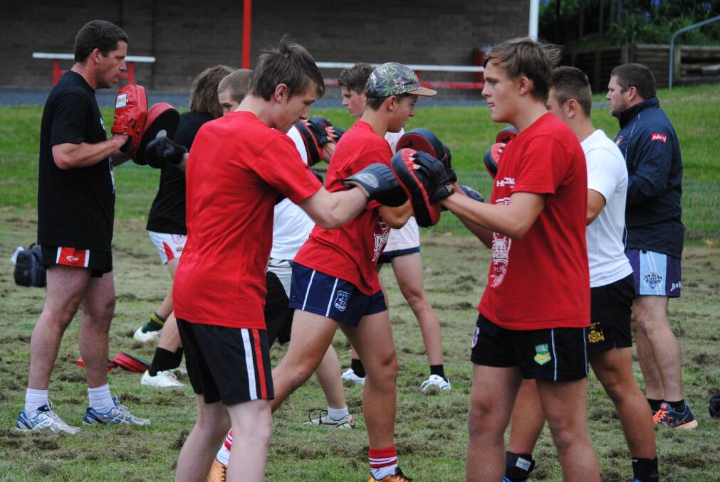 Moss Vale Dragons players work hard on their sparring techniques at training last Tuesday. Photo by Josh Bartlett