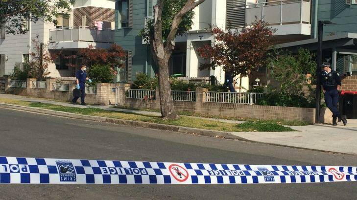 Police at the Yagoona townhouse where Walid Kamoun was shot in the head on Monday night.  Photo: Emma Partridge