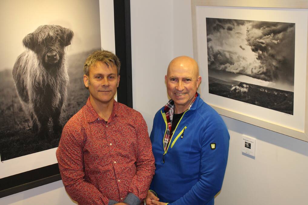Clayton Hairs and Mark Kelly with a couple of their images. Photo by Jen Walker